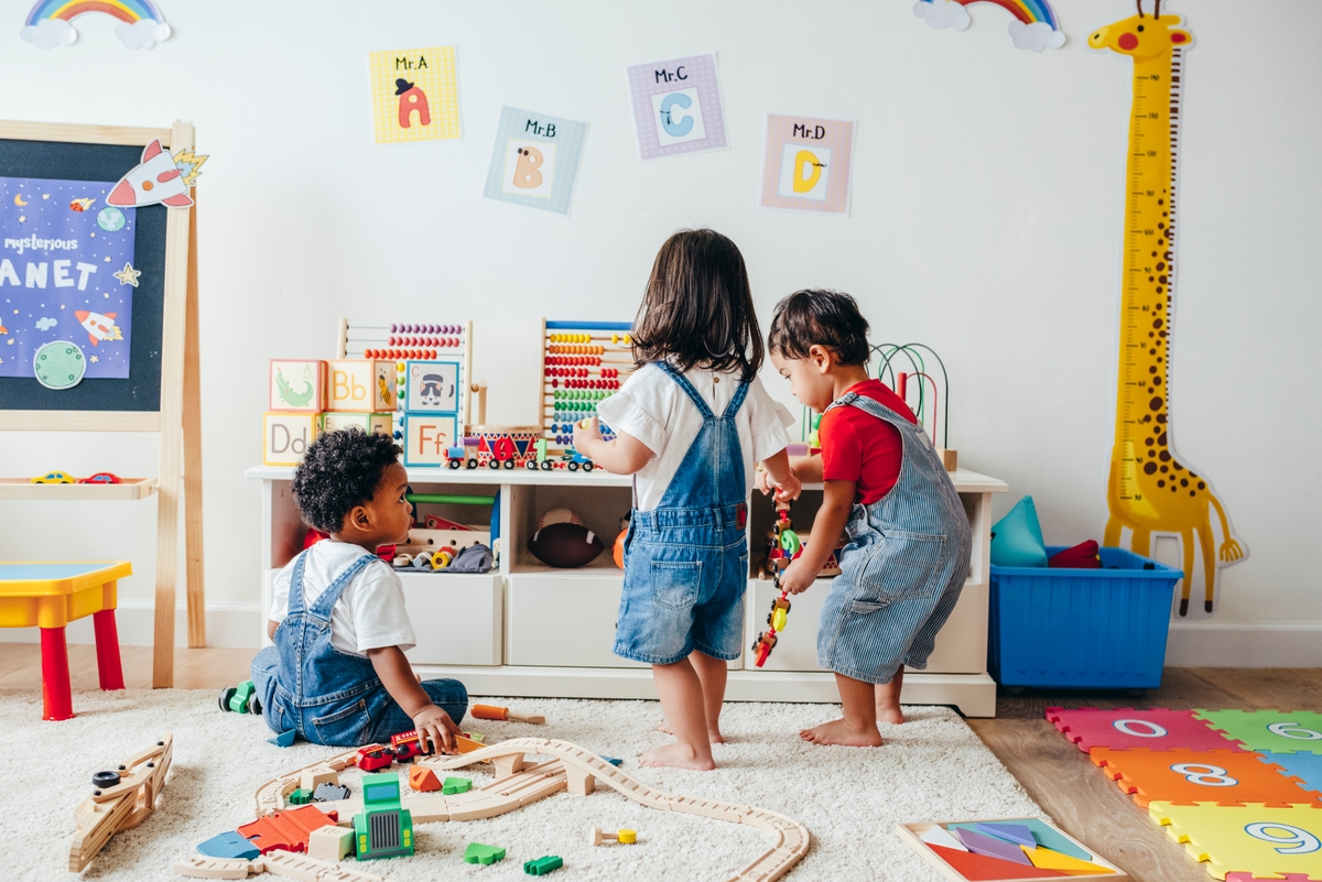 Young children enjoying in the playroom representing the work Clarence House Nursery provides.